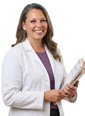 A woman with long black hair wearing a brown jacket stands confidently, showcasing her style and poise.