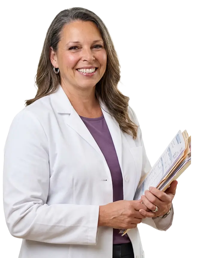 A woman with long black hair wearing a brown jacket stands confidently, showcasing her style and poise.