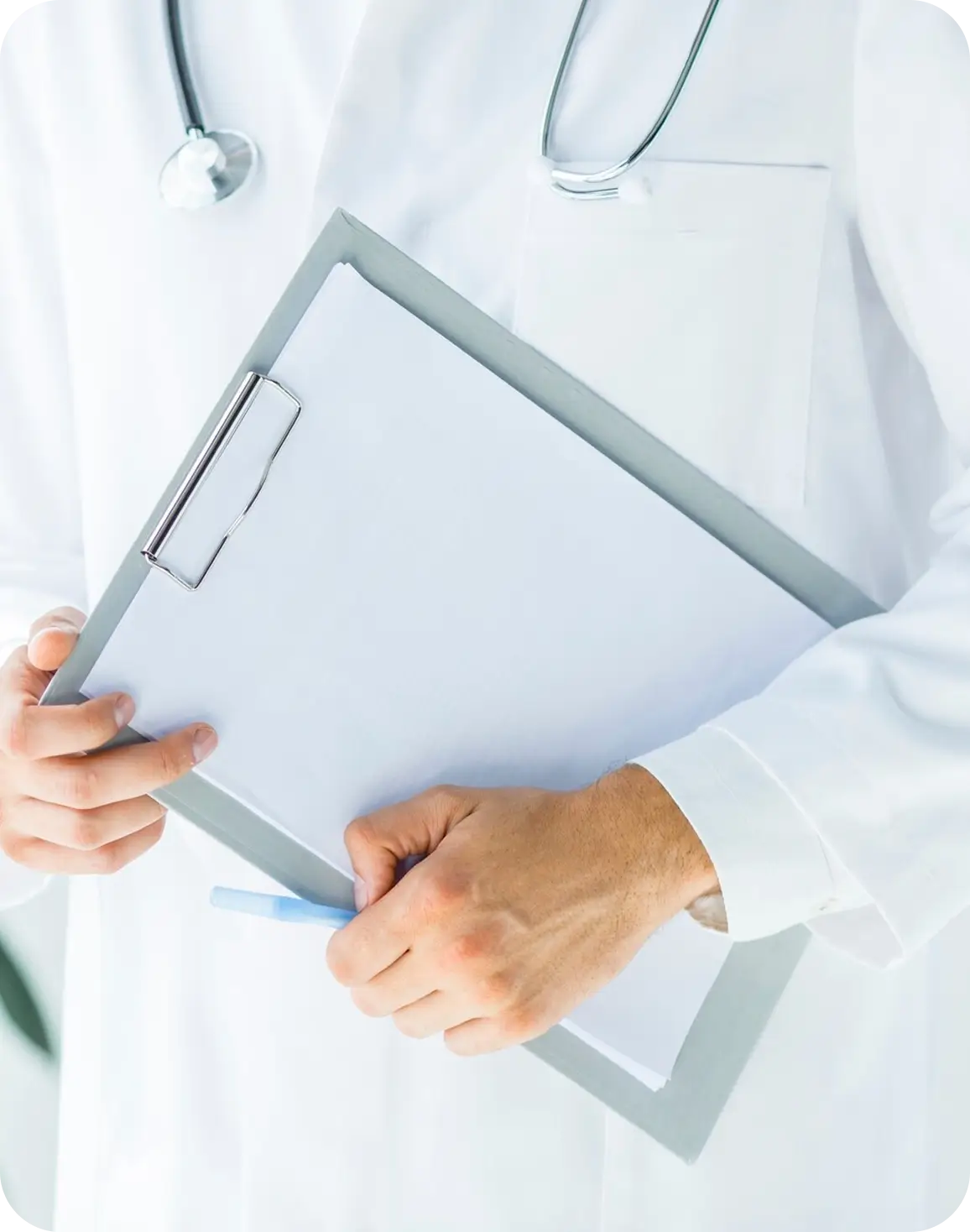 A provider, equipped with a clipboard and pen, is poised to record vital information during a patient consultation.