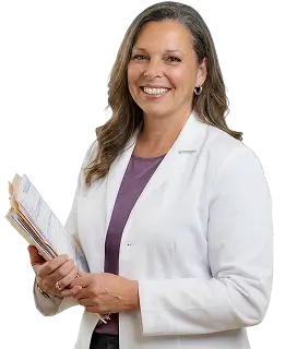 A woman in a white lab coat holds a folder, standing in a laboratory setting, conveying professionalism and focus.