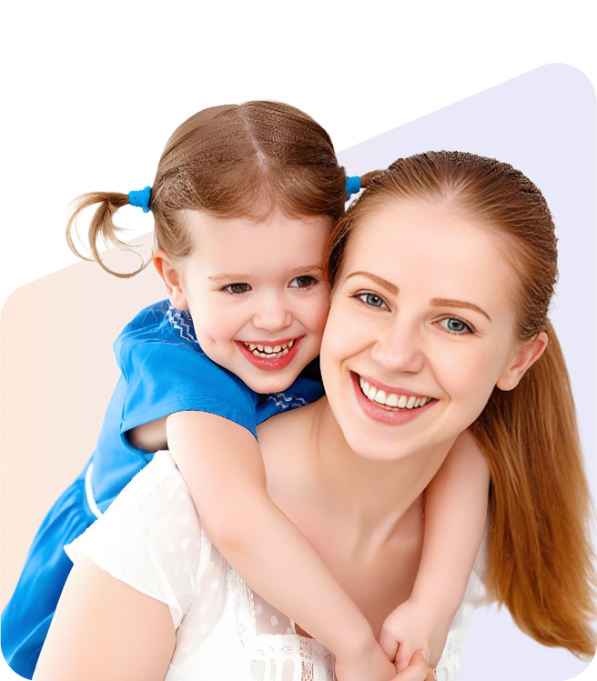 A woman and a child embrace each other, both smiling warmly at the camera.